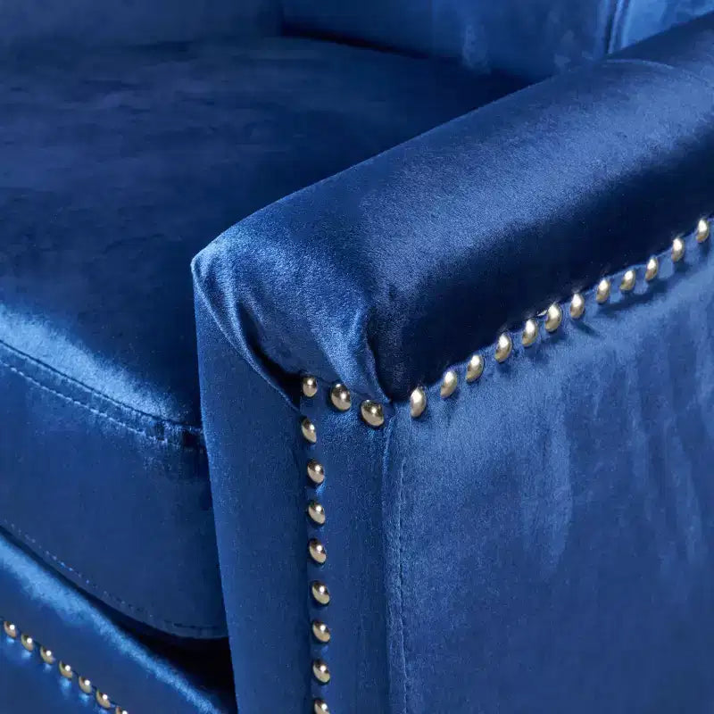 Fauteuil club capitonné en velours