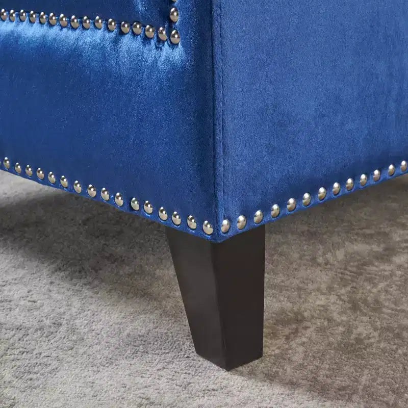 Fauteuil club capitonné en velours